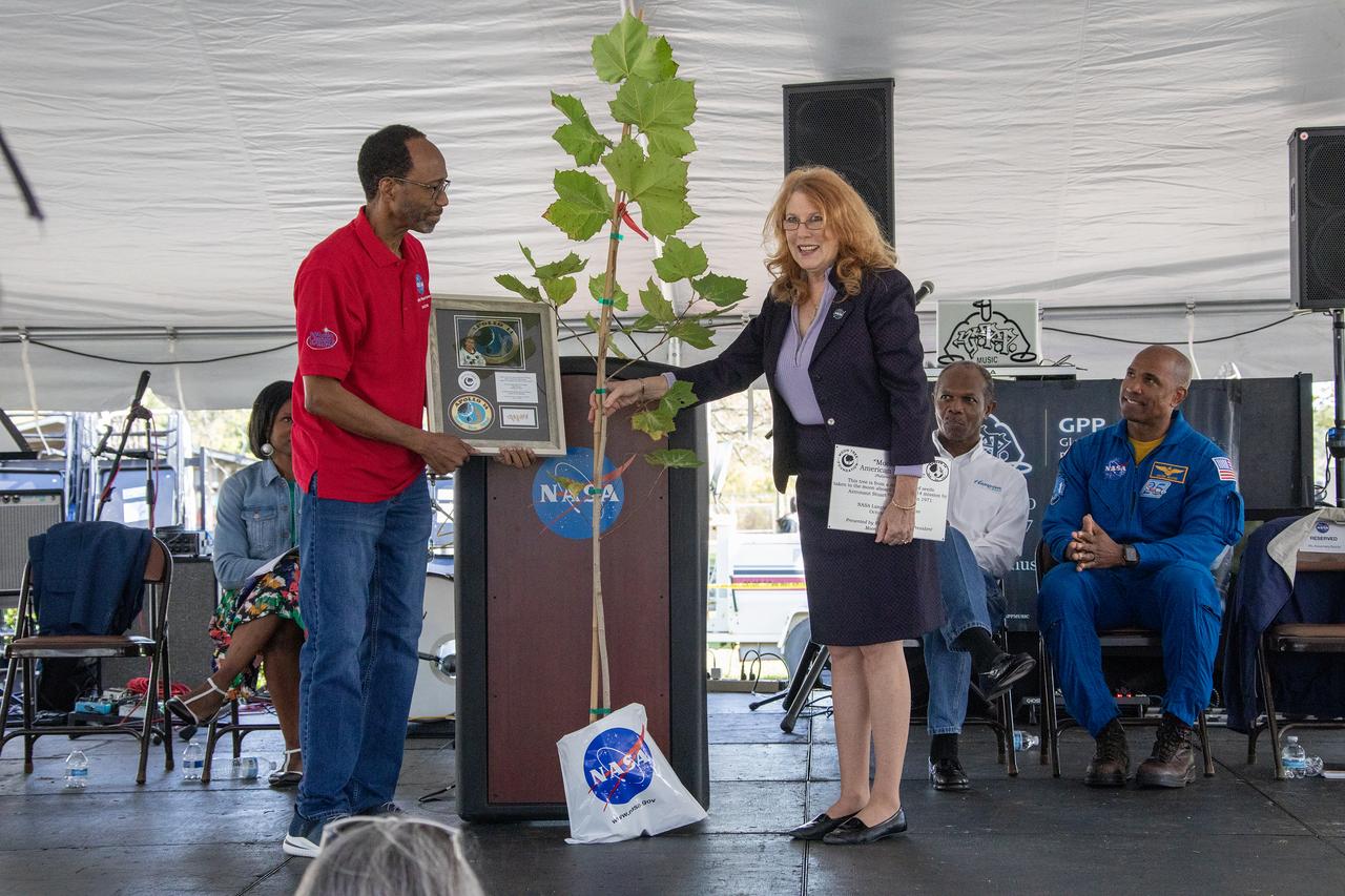 "Moon Tree" American Sycamore tree presented to Langley Center Director Clayton Moore by Rosemary Roosa, President of Moon Tree Foundation.  More than 37,000 people registered to attend the NASA Langley open house. Starting with the Annual 5K Moon Walk Run and the talented Nils Larson, X59 pilot and Astronaut Victor Glover reunited at Langley’s hangar and hosted by Center Director Clayton Turner.